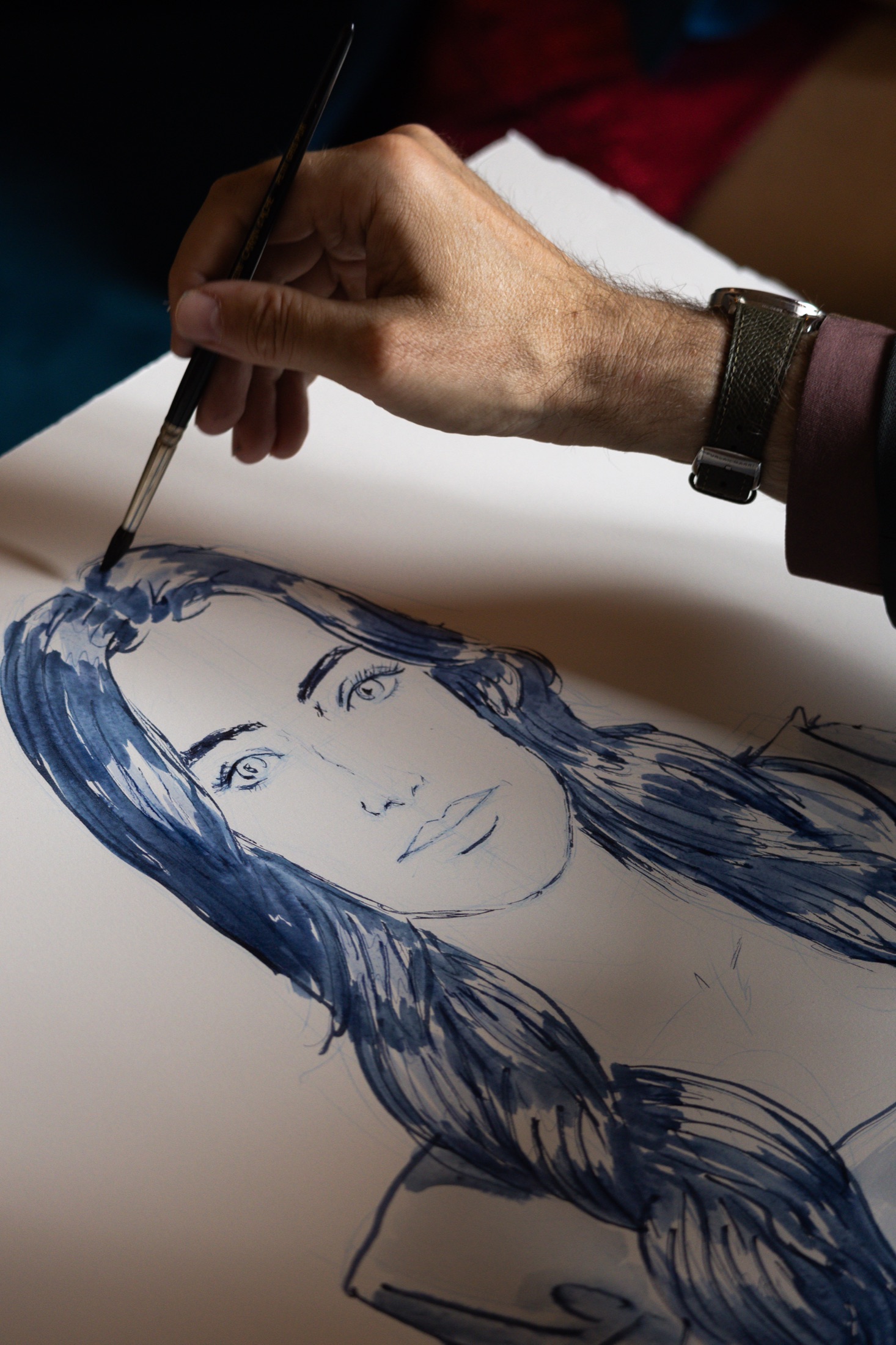 Mauro Carraro drawing Antonia's portrait at FRED Bar.