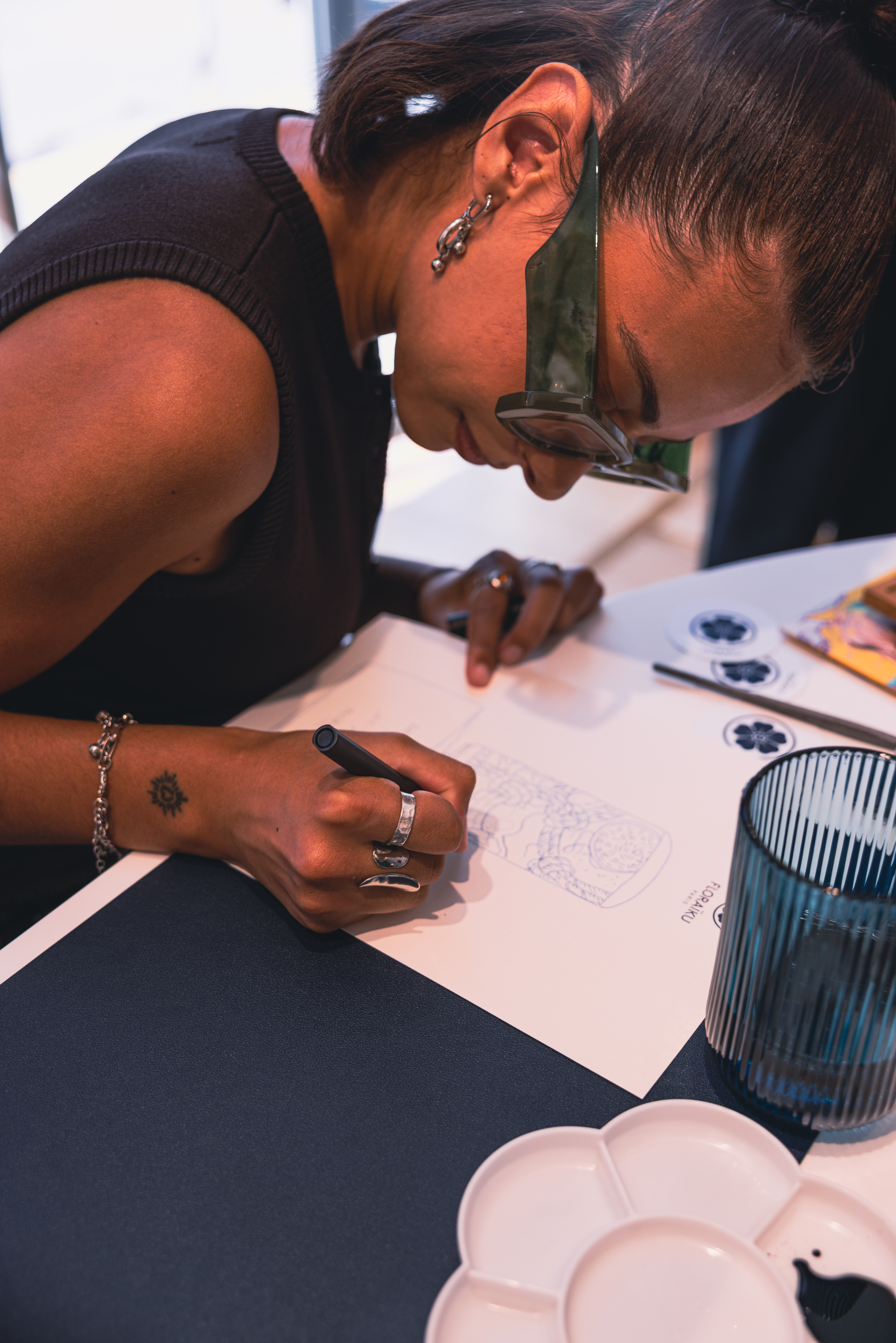 Participant concentrating during the Floraiku Paris workshop.