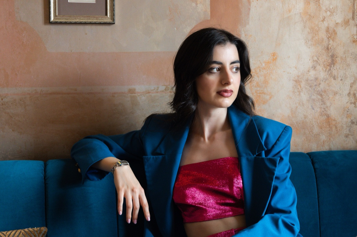 Antonia seated at FRED Bar during her portrait session.