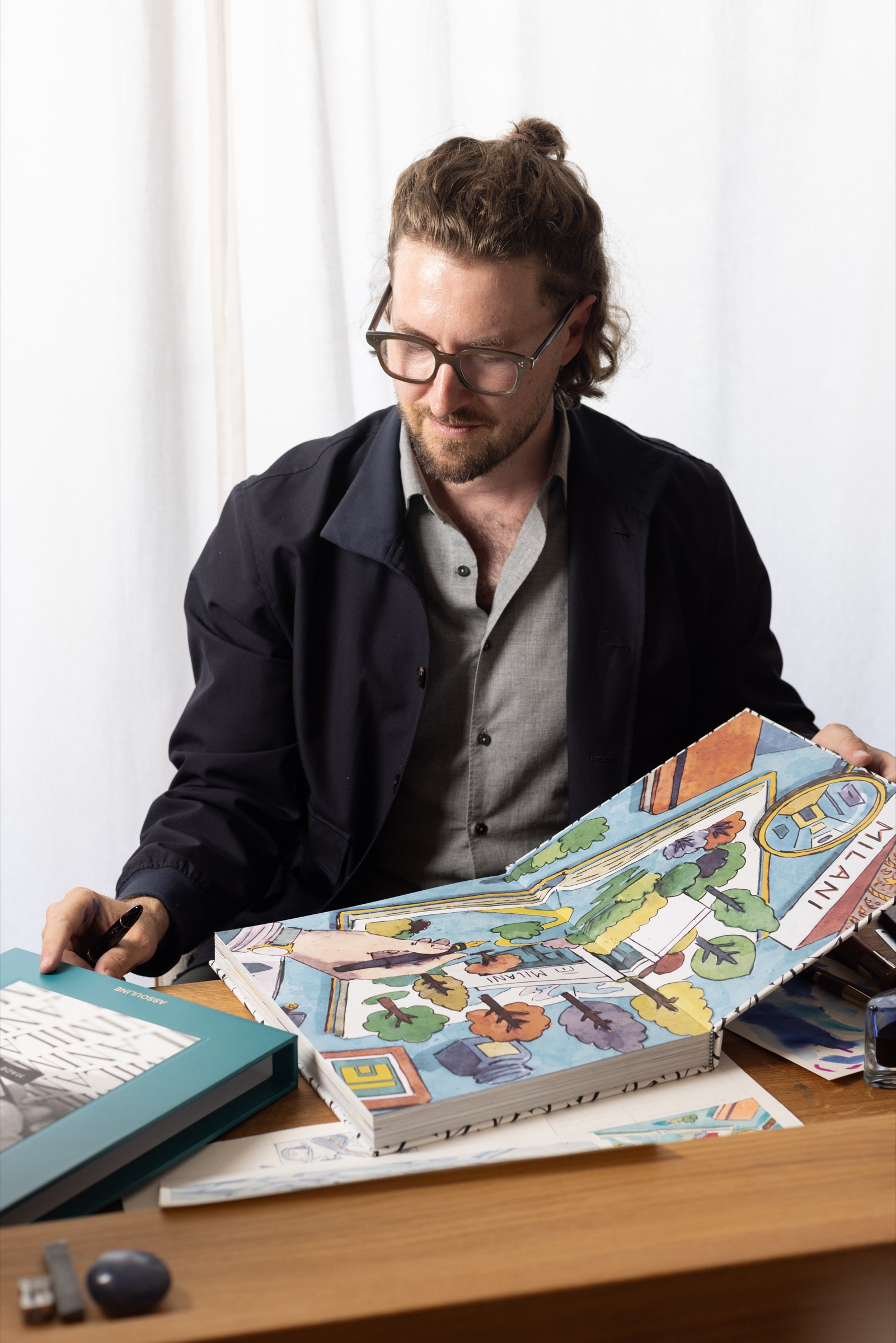 Grafiche Milani anniversary book and studio materials on Mauro Carraro's table. Photograph by Johann Sauty.