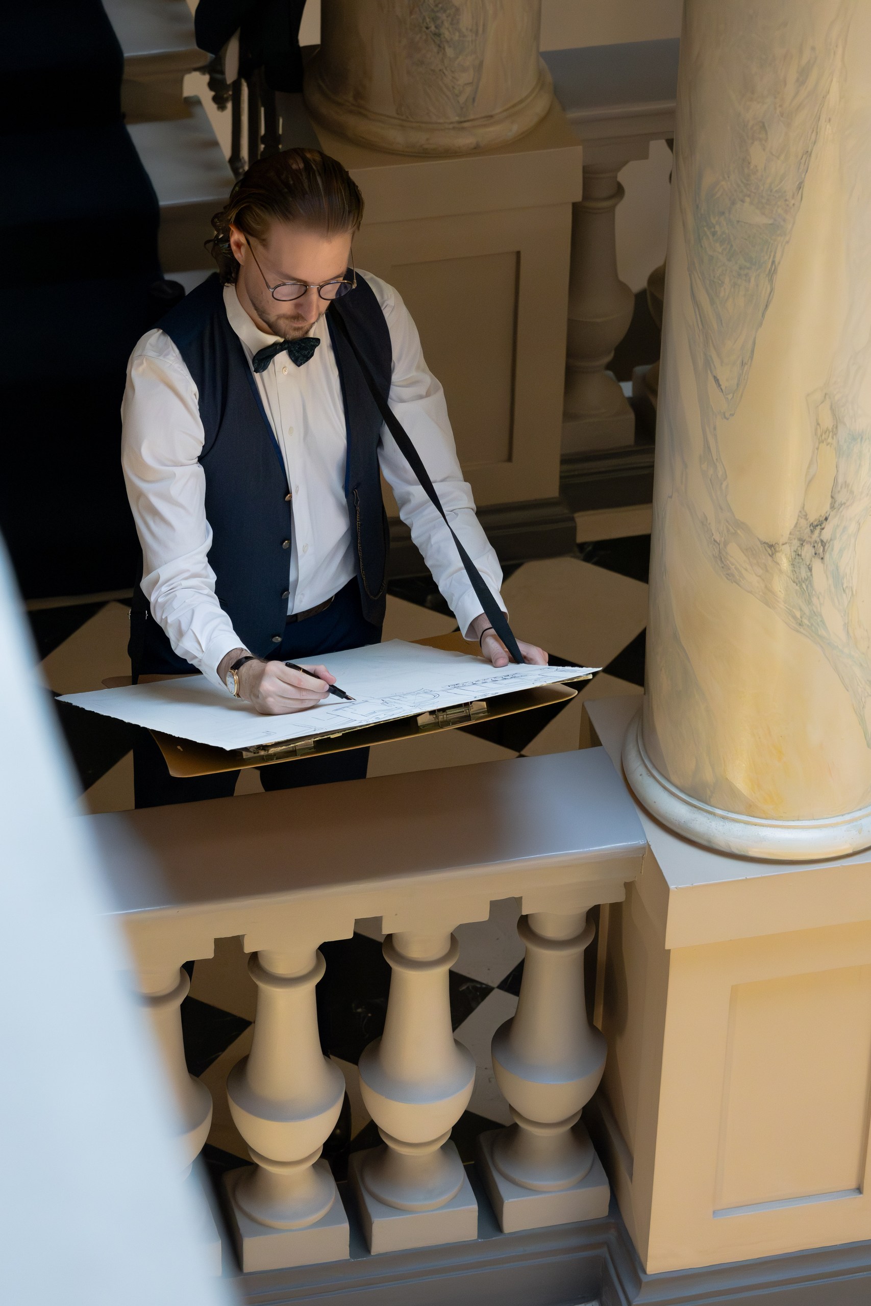 Mauro Carraro working on the chandelier drawing at The Ritz-Carlton Geneva.